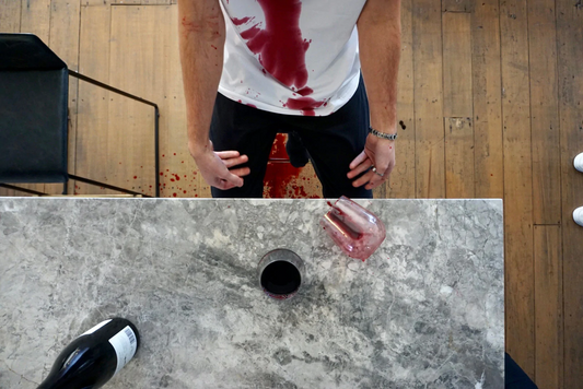 Red wine spilling on a white tee - Here's our guide to removing those stains