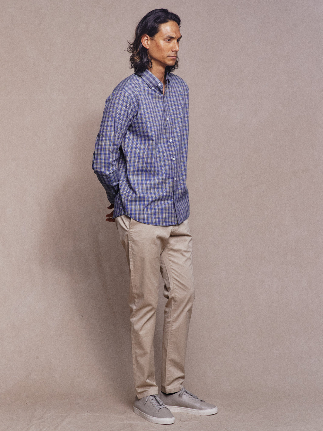 Model wearing Navy Check Light Cotton Button Down Shirt with tan chinos and grey sneakers