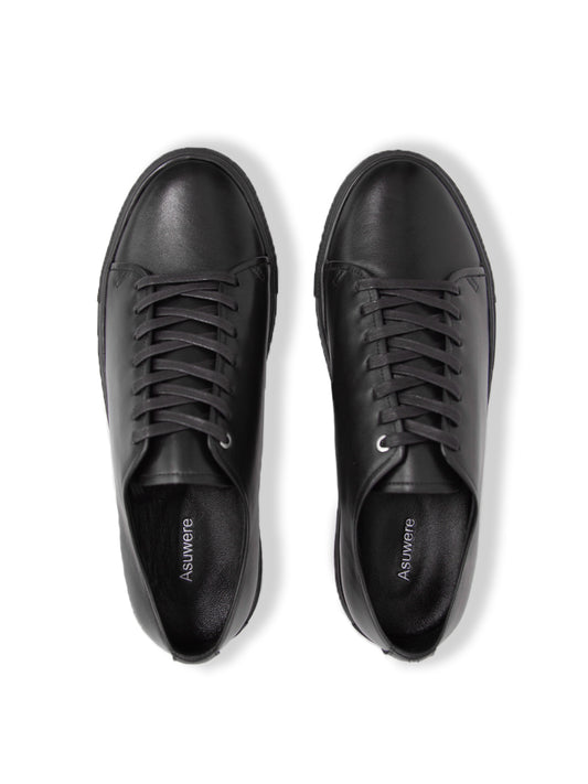 Birds eye view of black Leather Low Sneaker on white background