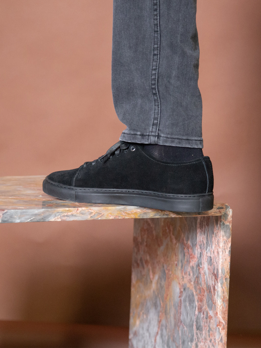 Close up shot of Asuwere leather sneakers in black