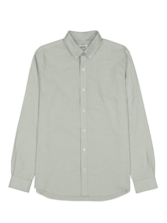 Front of green oxford shirt against white background